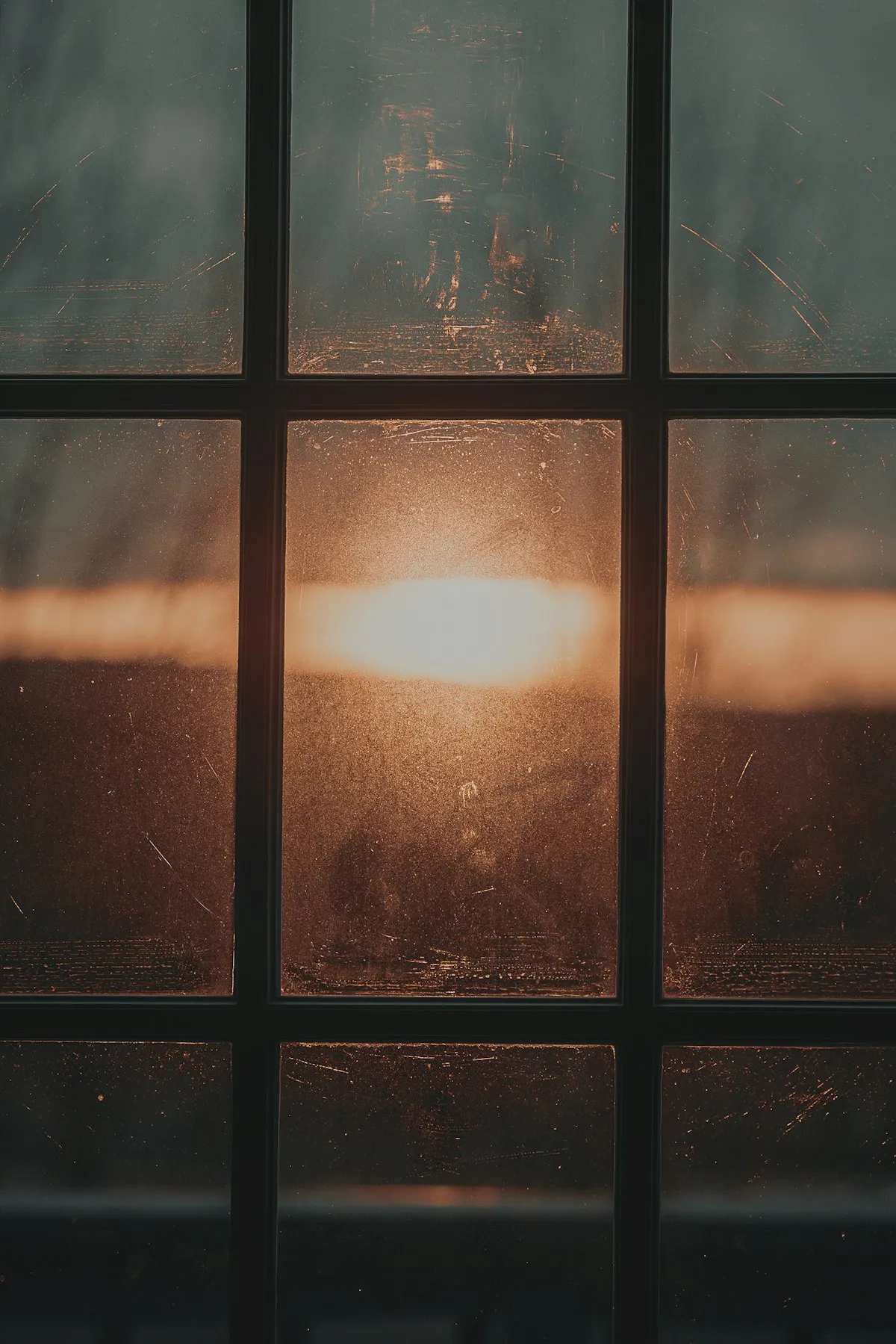 Soft golden sunlight streaming through a window at sunrise